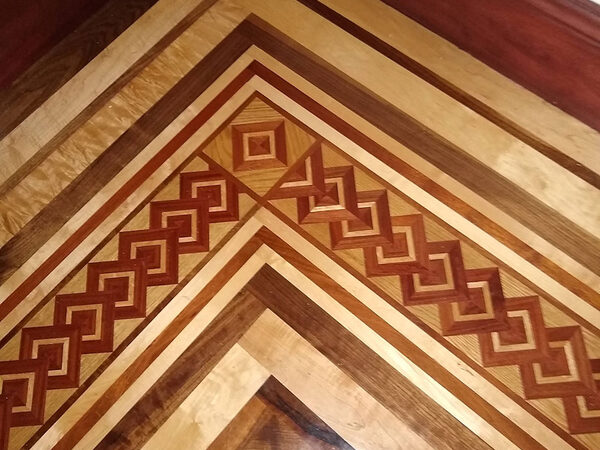 Custom parquet border inlay in contrasting wood species