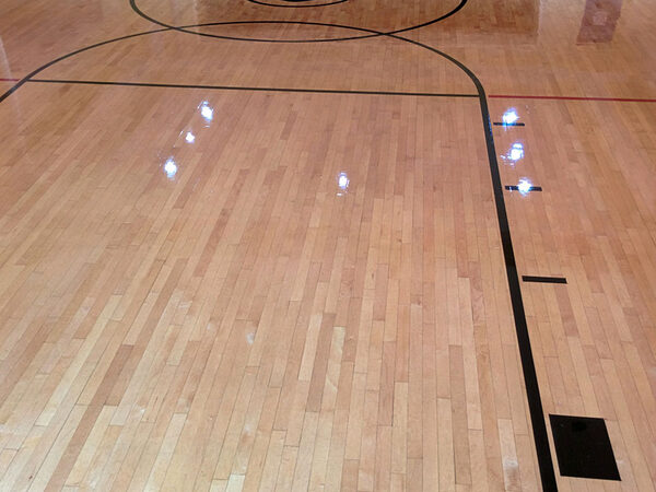 Gymnasium hardwood floor with game lines