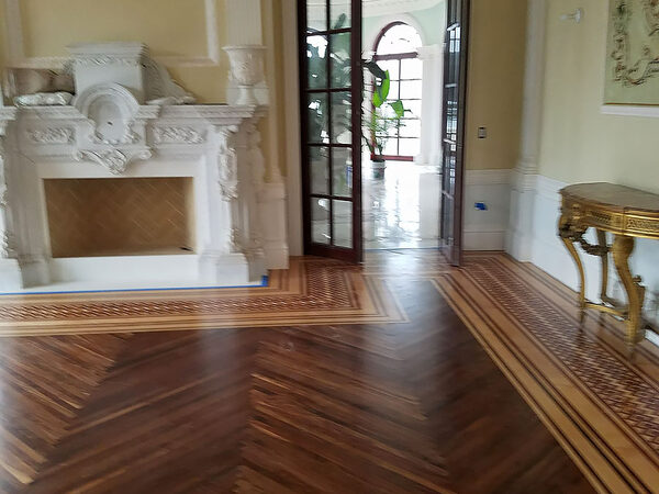 Herringbone floor with border in an entry hall