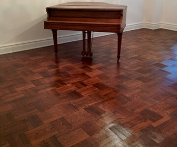 Floor repair — restored parquet floor in a classic interior