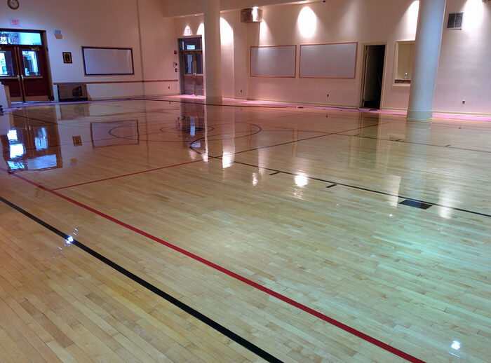 Large gymnasium wood floor after refinishing