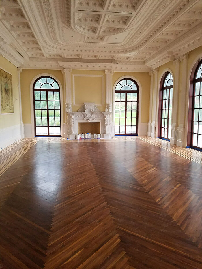 Herringbone floor with border in a grand hall
