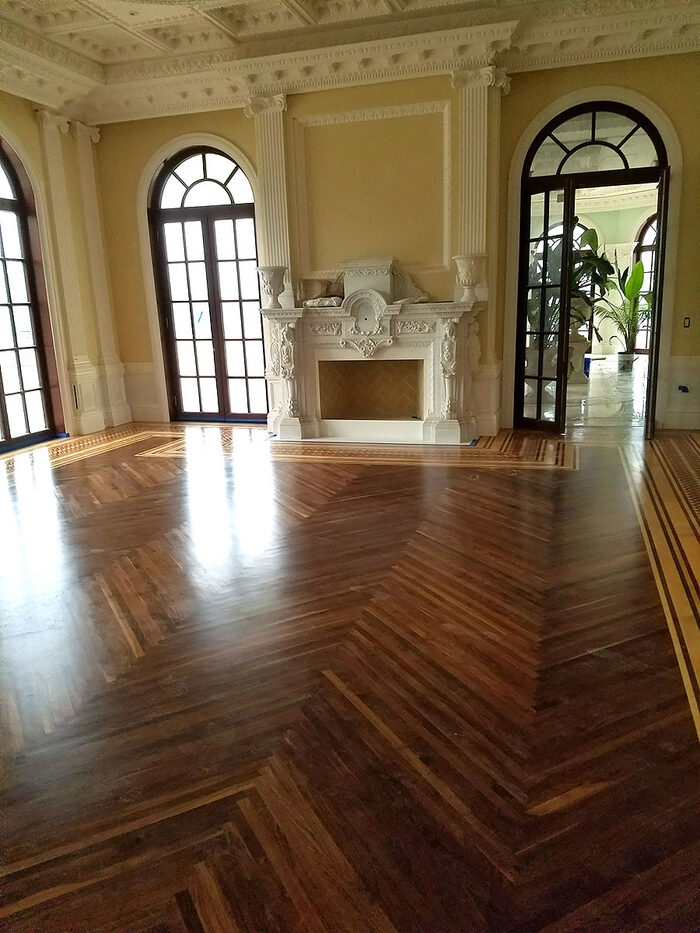 Dark stained herringbone floor in a formal room