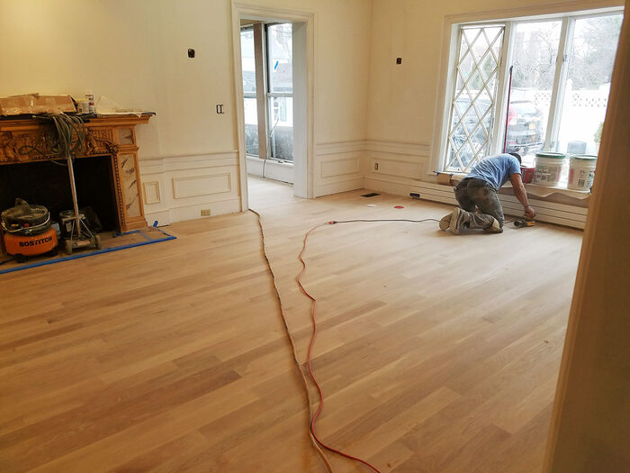 Hardwood floor sanding in progress during refinishing